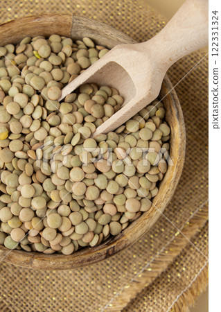 Raw green lentil Gluten free cereals. Health gut benefits. Concept of alternative whole spelt grain ingredient. Vegetarian diet recipes. Plant-based lifestyle. Copy space Protein rich 122331324