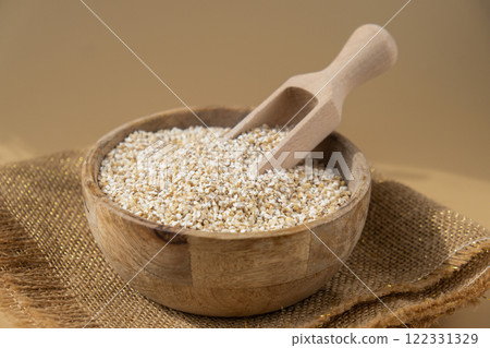 Raw fine ground barley porridge Gluten free cereals. Health gut benefits. Concept of alternative whole spelt grain ingredient. Vegetarian diet recipes. Plant-based lifestyle. Copy space Protein rich 122331329