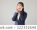 Young woman calling out to the distance_1 122331648