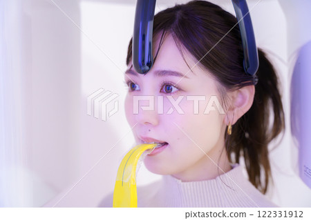 Young woman taking a dental x-ray 122331912