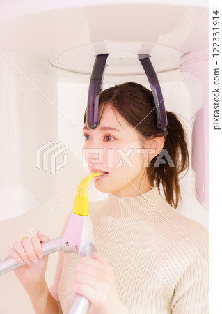Young woman taking a dental x-ray 122331914