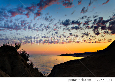 Sunset on Santa Eulalia Beach in Albufeira, Algarve region, Portugal Sunset on Santa Eulalia Beach in Albufeira, Algarve region, Portugal 122332074