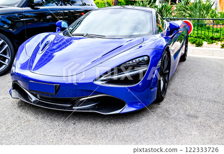 Blue sports car parked in downtown Monaco, French Riviera, France Blue sports car parked in downtown Monaco, French Riviera, France 122333726