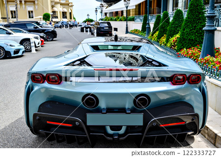 Turquoise sports car parked on the square of the Monte Carlo Casino in Monaco, French Riviera, France 122333727