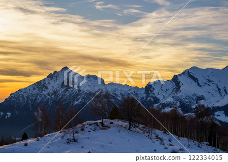 Snowy Mountain Peaks at Sunset with Golden Sky, Piani di Bobbio, Italy 122334015