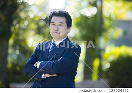 Senior man in a suit in the park Senior man in a suit in the park 122334322