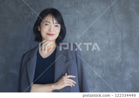 Middle-aged woman in a suit 122334449