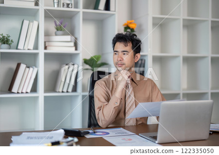 Business strategy meeting in modern office professional setting focused discussion thoughtful environment Business strategy meeting in modern office professional setting focused discussion thoughtful environment 122335050