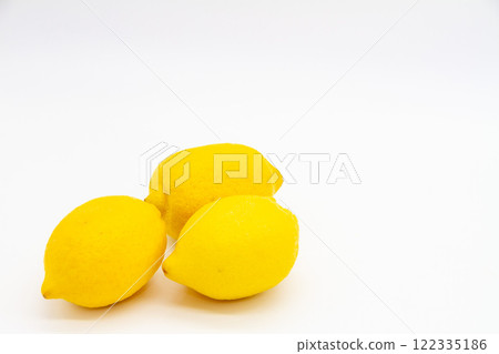 Three lemons on a white background Three lemons on a white background 122335186