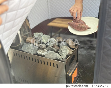 Baked sweet potatoes in the sauna Baked sweet potatoes in the sauna 122335787