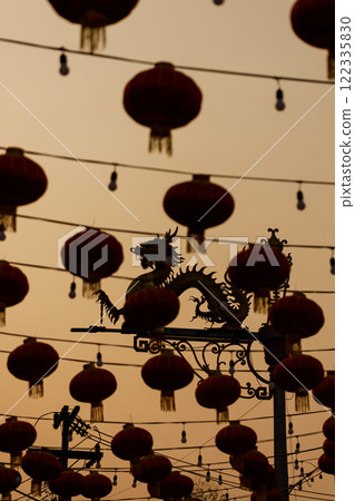 Lunar or Chinese new year lanterns decorated against dragon shape lamp post 122335830