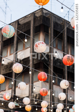 Lunar or Chinese new year lanterns decorated over street, Thailand. The letters mean Luck, Congratulations, Blessing and Happiness Lunar or Chinese new year lanterns decorated over street, Thailand. The letters mean Luck, Congratulations, Blessing and Happiness 122335855