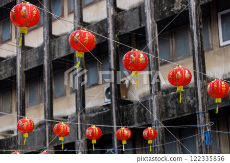 Lunar or Chinese new year lanterns decorated over street, Thailand. The letters mean Luck, Congratulations, Blessing and Happiness Lunar or Chinese new year lanterns decorated over street, Thailand. The letters mean Luck, Congratulations, Blessing and Happiness 122335856