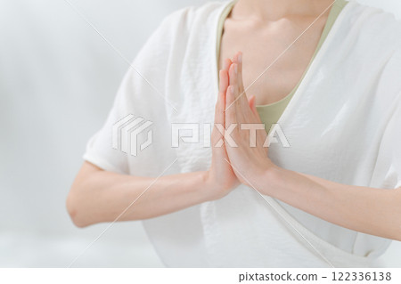 The hands of a woman in her 30s praying The hands of a woman in her 30s praying 122336138