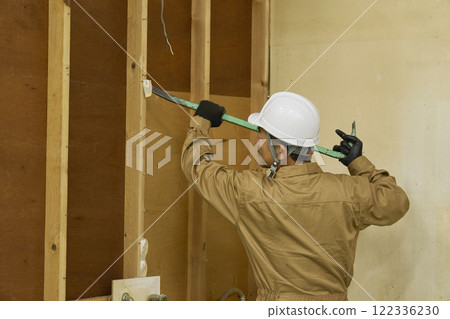 A male demolition worker working 122336230