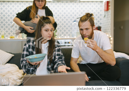 Candid Family Moments Enjoying a Relaxing Time Together in the Comforts of Home 122336779