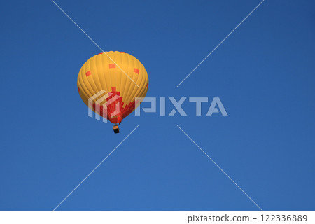Yellow orange hot air balloon over Vang Vieng, Laos. 122336889