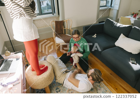 Cherishing Family Togetherness Beautiful Moments at Home Enjoying Time with a Baby 122337052