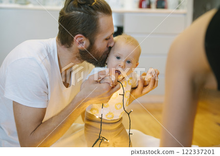 A Playful and Joyful Moment Between Father and Baby at Home Full of Love and Laughter 122337201