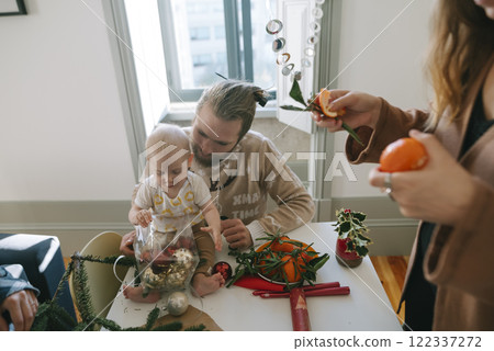 Enjoying a Family Gathering with a Baby during the Festive Season Full of Joy and Cheer Enjoying a Family Gathering with a Baby during the Festive Season Full of Joy and Cheer 122337272