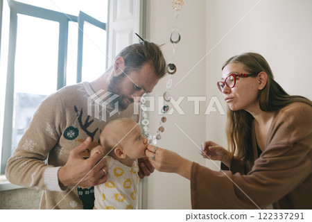 Cherishing Family Bonding Moments Enjoying Playful Interactions with Your Baby Together Cherishing Family Bonding Moments Enjoying Playful Interactions with Your Baby Together 122337291