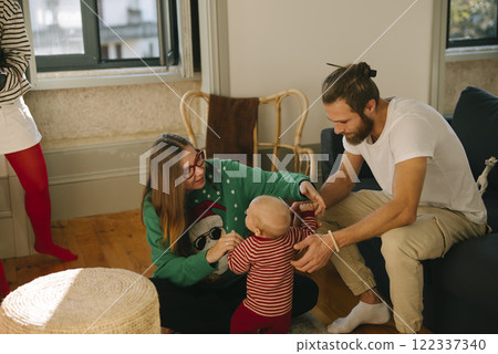 Joyful and Cherished Family Moments A Delightful and Playful Interaction with a Baby 122337340