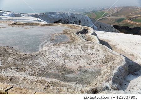 Carbonate travertines the natural pools during. Turkey 122337905