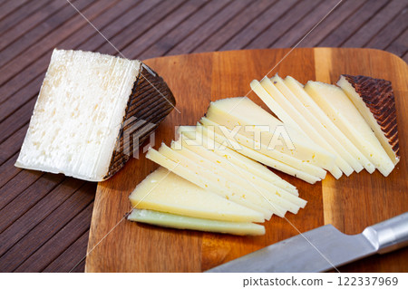 Sliced italian cured sheep cheese Pecorino 122337969