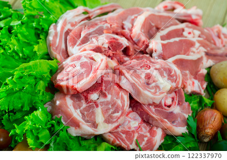 Raw lamb meat with vegetables Raw lamb meat with vegetables 122337970