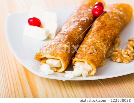 Pancakes with filling from brynza and walnuts, bulgarian dish palachinki 122338028