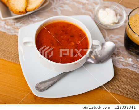 Borsch, beetroot hot soup and bread on table in a cafe 122338311