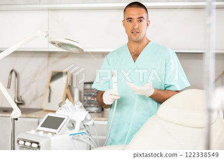 cosmetologist displays Hydrogen Oxygen Cleaner 122338549