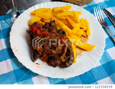 Lamb osso bucco with potatoes and vegetables on white plate Lamb osso bucco with potatoes and vegetables on white plate 122338559