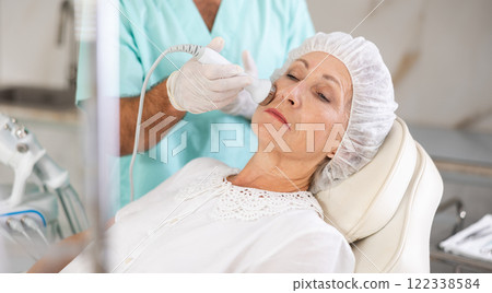 male doctor uses ultrasonic import 122338584