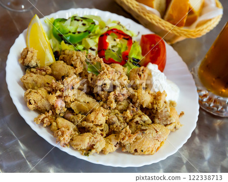 Chipirones battered fried baby squid Chipirones battered fried baby squid 122338713