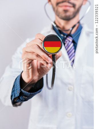Germany health and medical insurance concept. Germany Healthcare System, doctor holding stethoscope Germany health and medical insurance concept. Germany Healthcare System, doctor holding stethoscope 122339321