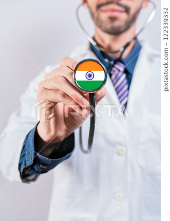 India health and medical insurance concept. Healthcare System India, doctor holding stethoscope India health and medical insurance concept. Healthcare System India, doctor holding stethoscope 122339332