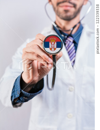 Serbia health and medical insurance concept. Serbia Healthcare System, doctor holding stethoscope 122339338