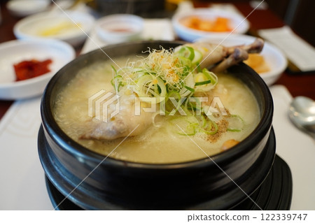Samgyetang is a traditional Korean chicken dish that is a health food. Samgyetang is a traditional Korean chicken dish that is a health food. 122339747