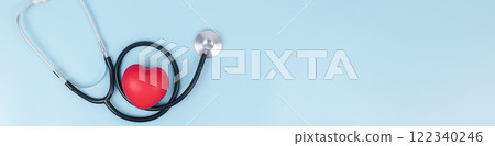 Stethoscope and red hearts on light blue background, Health care concept, Hospital life insurance concept, World heart health day, Doctor day, World hypertension day. Stethoscope and red hearts on light blue background, Health care concept, Hospital life insurance concept, World heart health day, Doctor day, World hypertension day. 122340246