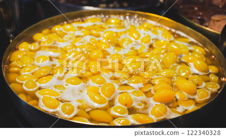 Ginkgo nuts boiling in syrup, a delicious and nutritious dessert often enjoyed in Asian cuisine. Ginkgo nuts boiling in syrup, a delicious and nutritious dessert often enjoyed in Asian cuisine. 122340328