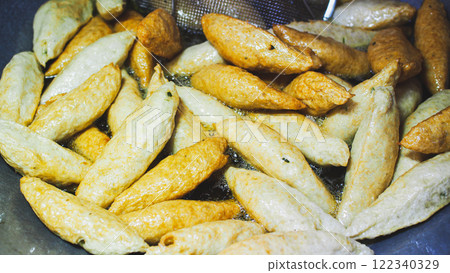 fried fish balls or fish cakes, a popular street food known for their crispy texture and savory flavor. fried fish balls or fish cakes, a popular street food known for their crispy texture and savory flavor. 122340329