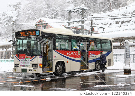 A Kan'etsu Kotsu bus parked in front of Minakami Station in winter 122340384