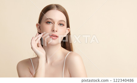 Beautiful young woman with clean fresh skin on beige background, Face care, Facial treatment, Cosmetology, beauty and spa, women portrait. 122340486