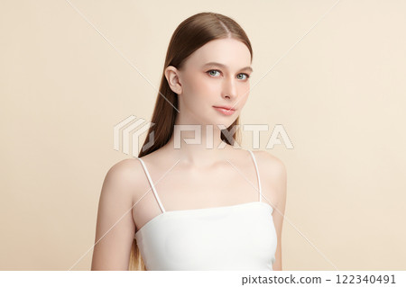 Beautiful young woman with clean fresh skin on beige background, Face care, Facial treatment, Cosmetology, beauty and spa, women portrait. Beautiful young woman with clean fresh skin on beige background, Face care, Facial treatment, Cosmetology, beauty and spa, women portrait. 122340491