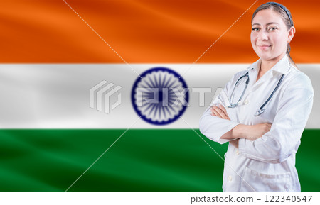 Female doctor on India flag. Doctor with crossed arms on India flag. India Health and Care concept Female doctor on India flag. Doctor with crossed arms on India flag. India Health and Care concept 122340547
