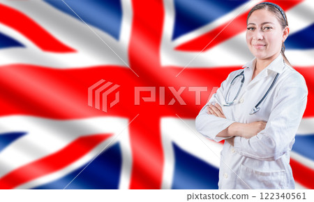 Female doctor on UK flag. Doctor with crossed arms on UK flag. UK Health and Care concept. 122340561
