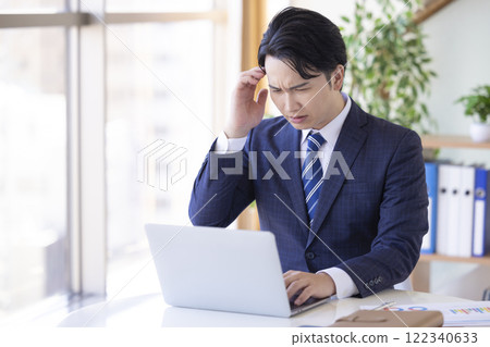 Business desk work man thinking Business desk work man thinking 122340633