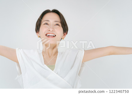 Smiling woman taking a deep breath 122340750