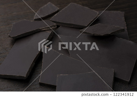 Broken bar of dark chocolate 122341912
